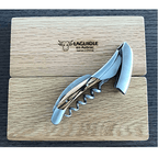 Corkscrew with lever raised resting on the engraved Laguiole en Aubrac oak lid