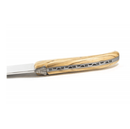 Close view of the olive wood handle and decorated spine