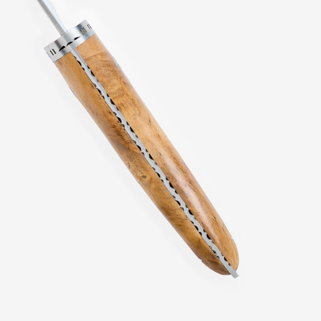 Teak handle seen from above with the decorated spine