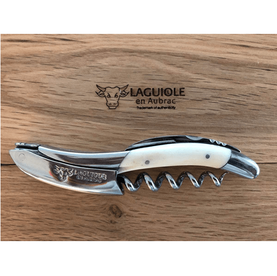 Bone handled corkscrew on the engraved Laguiole en Aubrac oak lid