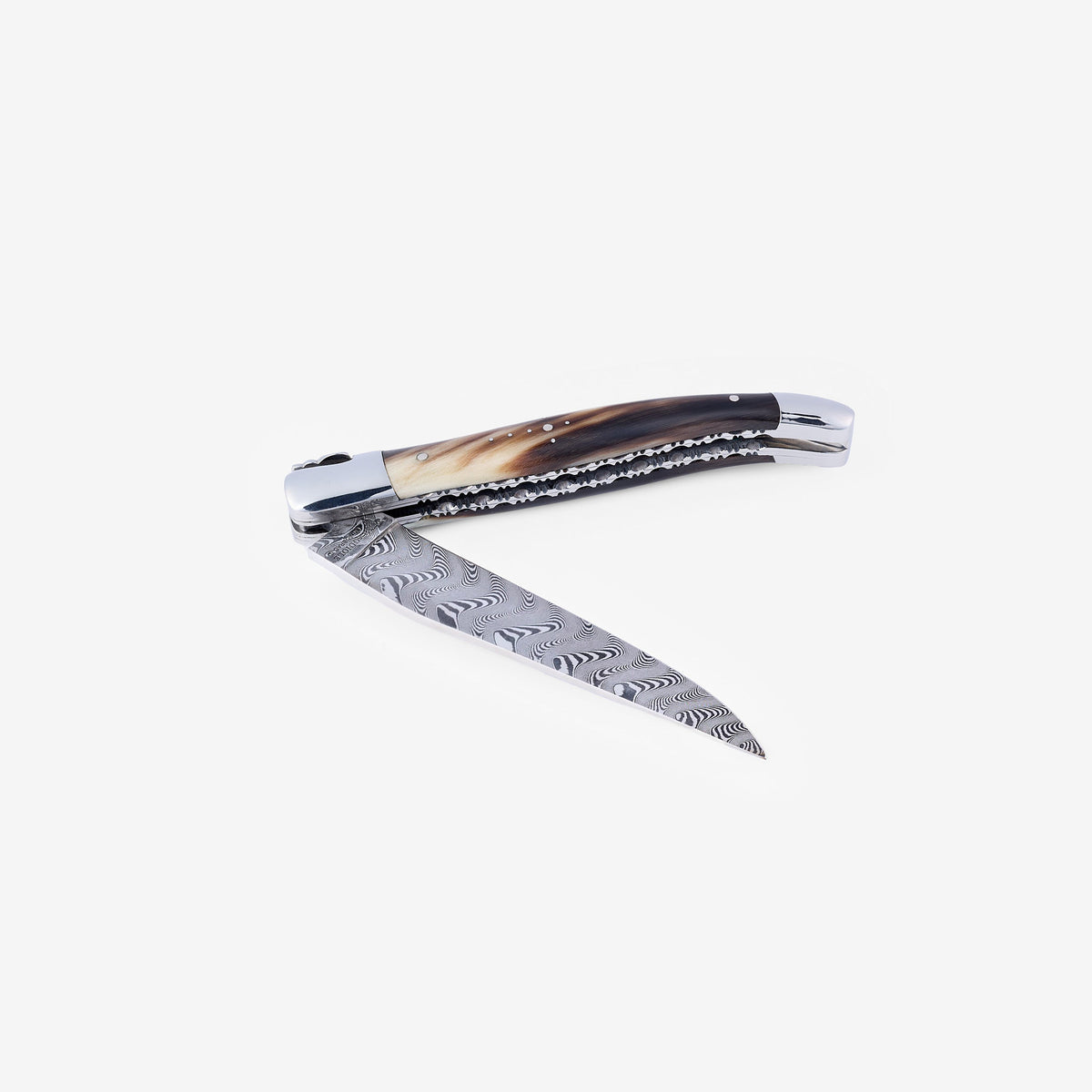 Knife half open with the Damascus blade angled down
