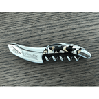 Nougatine handled corkscrew on a dark wood table
