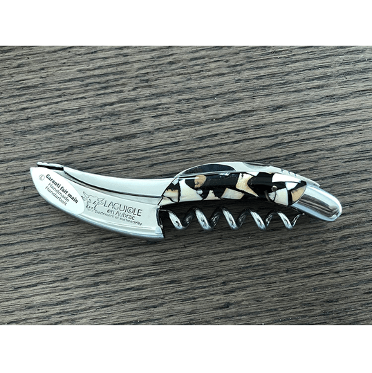 Nougatine handled corkscrew on a dark wood table