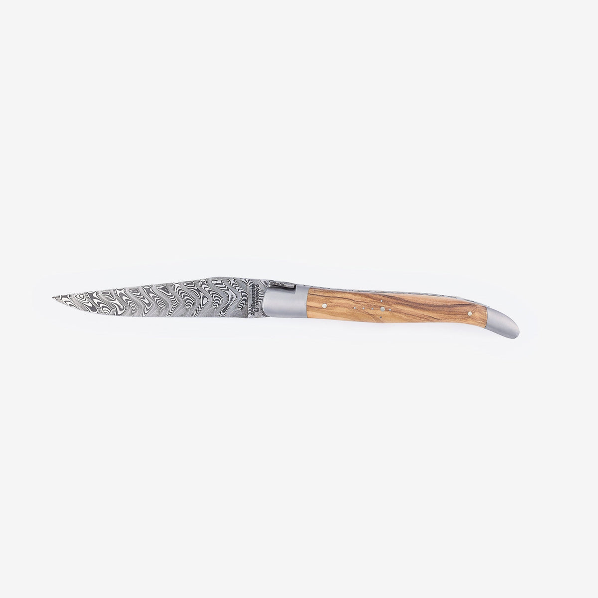 Laguiole Balbach Damascus olive wood knife open on a pale background