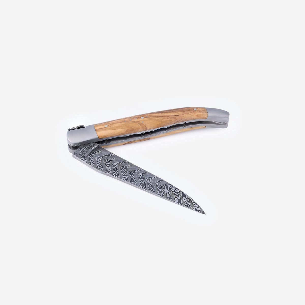 Knife half open with the Damascus blade pointing down