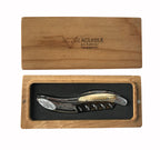 Corkscrew with cream and dark handle in an open French oak gift box