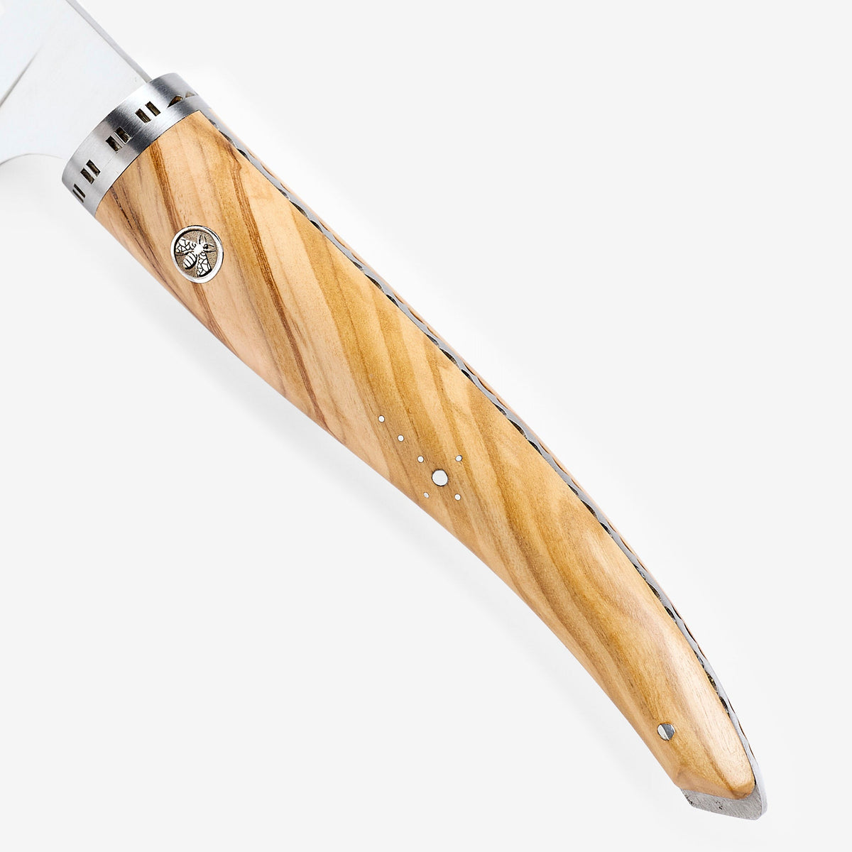 Close view of the olive wood grain, rivet and bolster