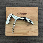 Corkscrew opened on the engraved oak lid with the spiral extended