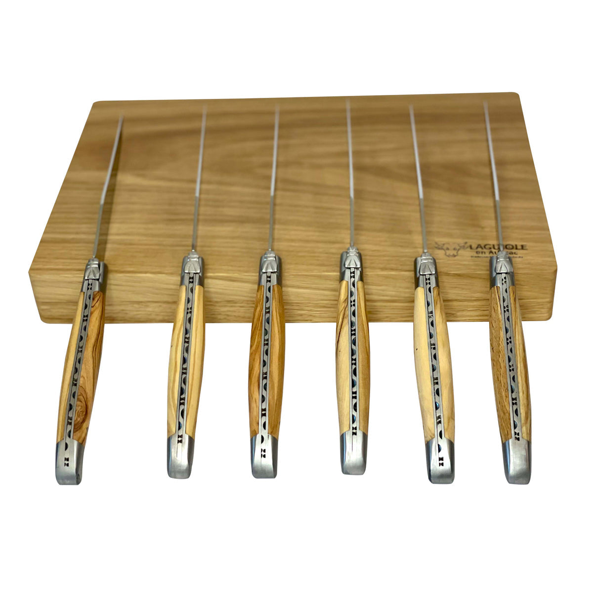 Six olive wood steak knives standing upright against the box