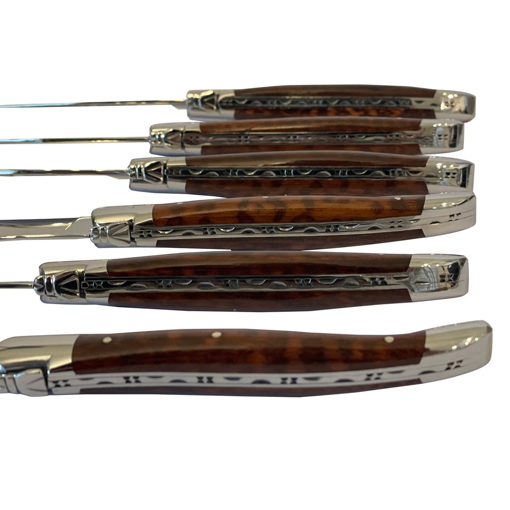 Close view of the carved spines and amourette handles
