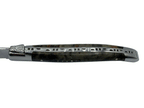 Close view of the carved spine along the burl handle