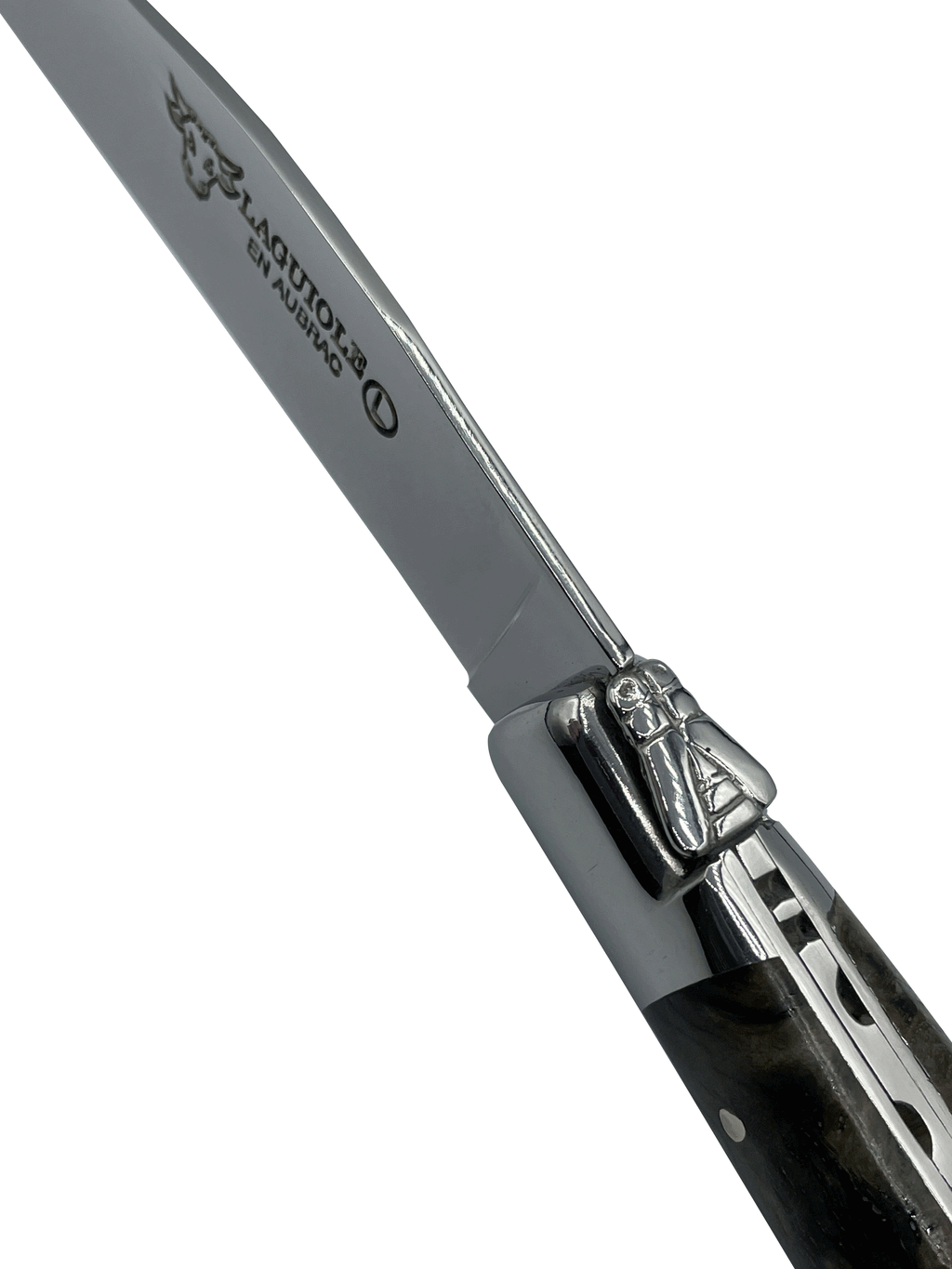 Close view of the bolster and engraved blade