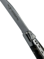 Close view of the bolster and engraved blade