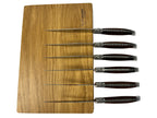 Six knives laid across the wooden box lid