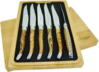 Six knives standing upright in the box tray with handles facing out