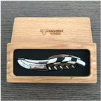 Black and ivory checkerboard corkscrew in an open French oak gift box