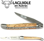 Olive wood knife half open showing the decorated spring
