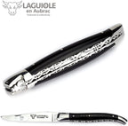 Closed knife at an angle showing the decorated back