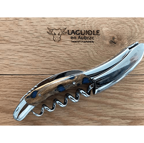 Close view of the patterned cactus handle and polished steel on the oak lid