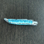 Closed Larimar knife showing the worked spring and bee