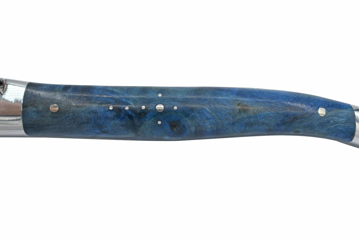 Close view of a blue poplar burl handle with steel pins