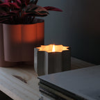soy wax candle ceramic planter lit on a shelf