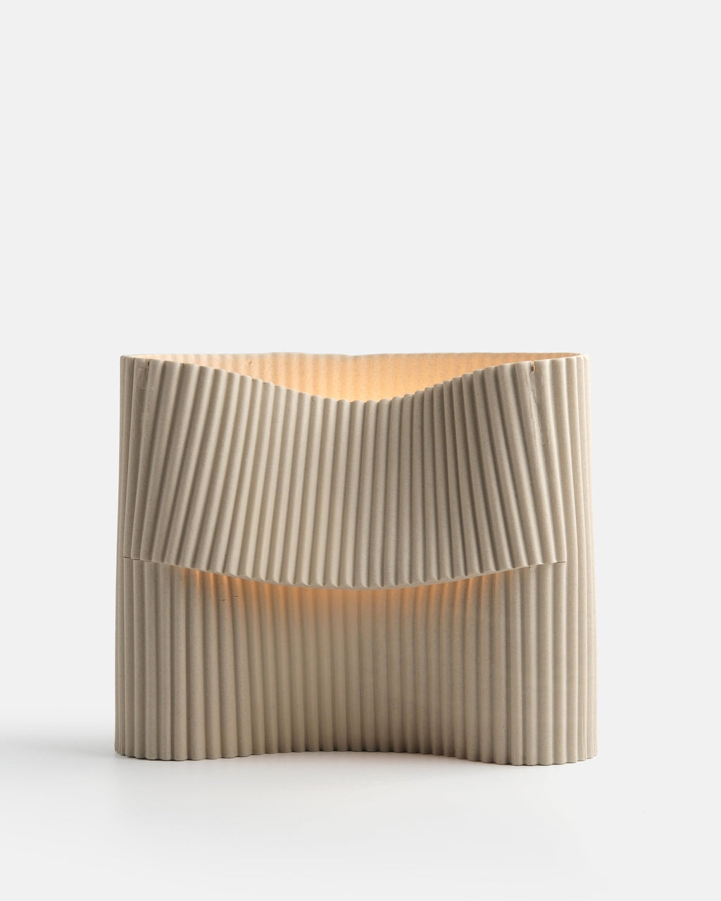 corduroy ceramic table lamp on a console in dune glaze