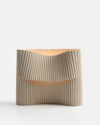 corduroy ceramic table lamp on a console in dune glaze