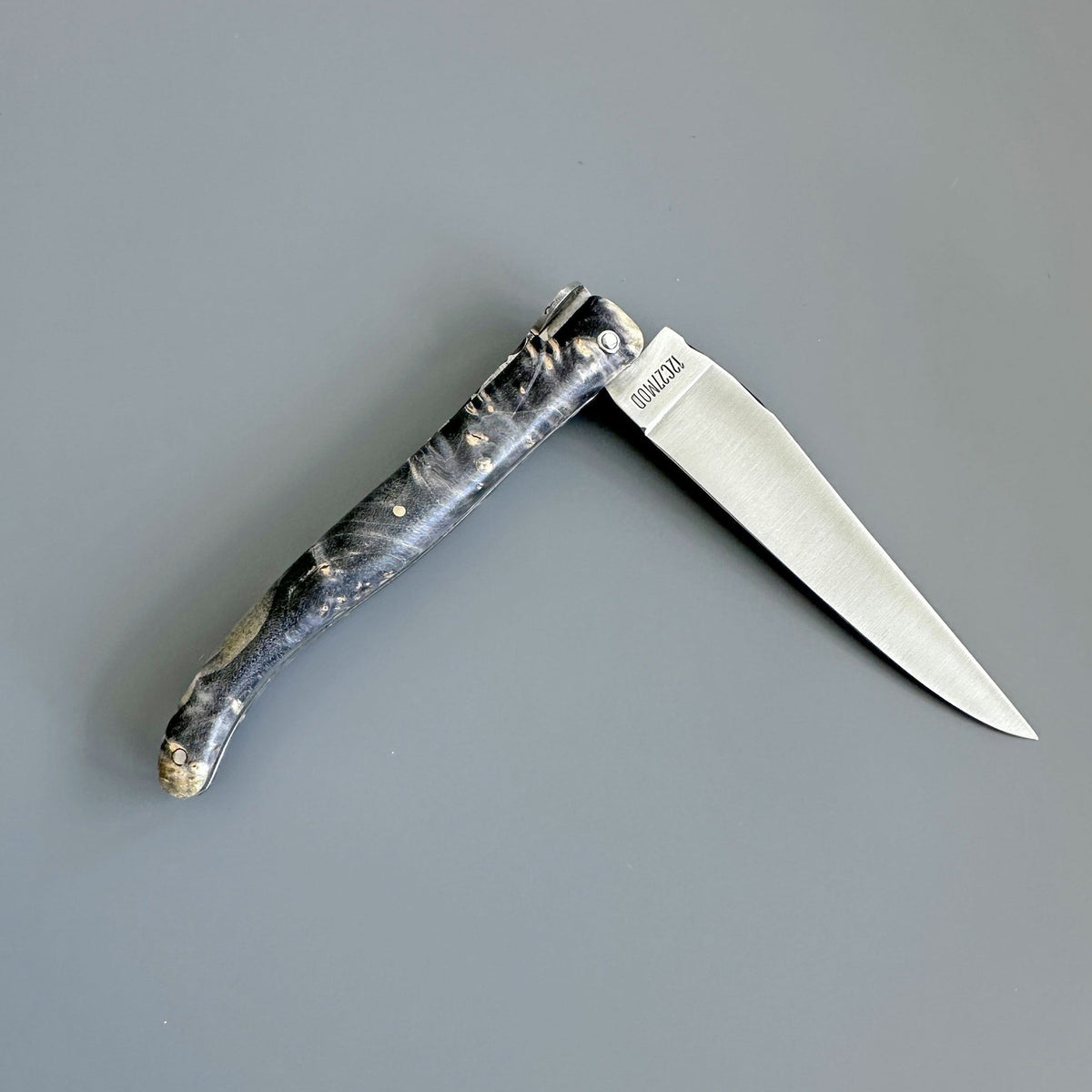 Knife half open with the blade pointing right