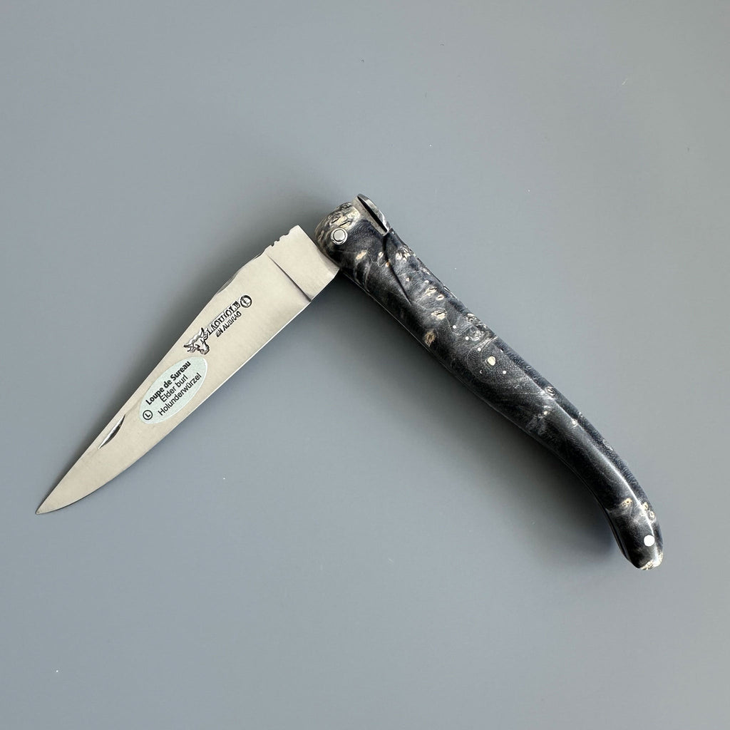 Knife half open with the blade pointing left