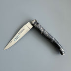 Knife half open with the blade pointing left