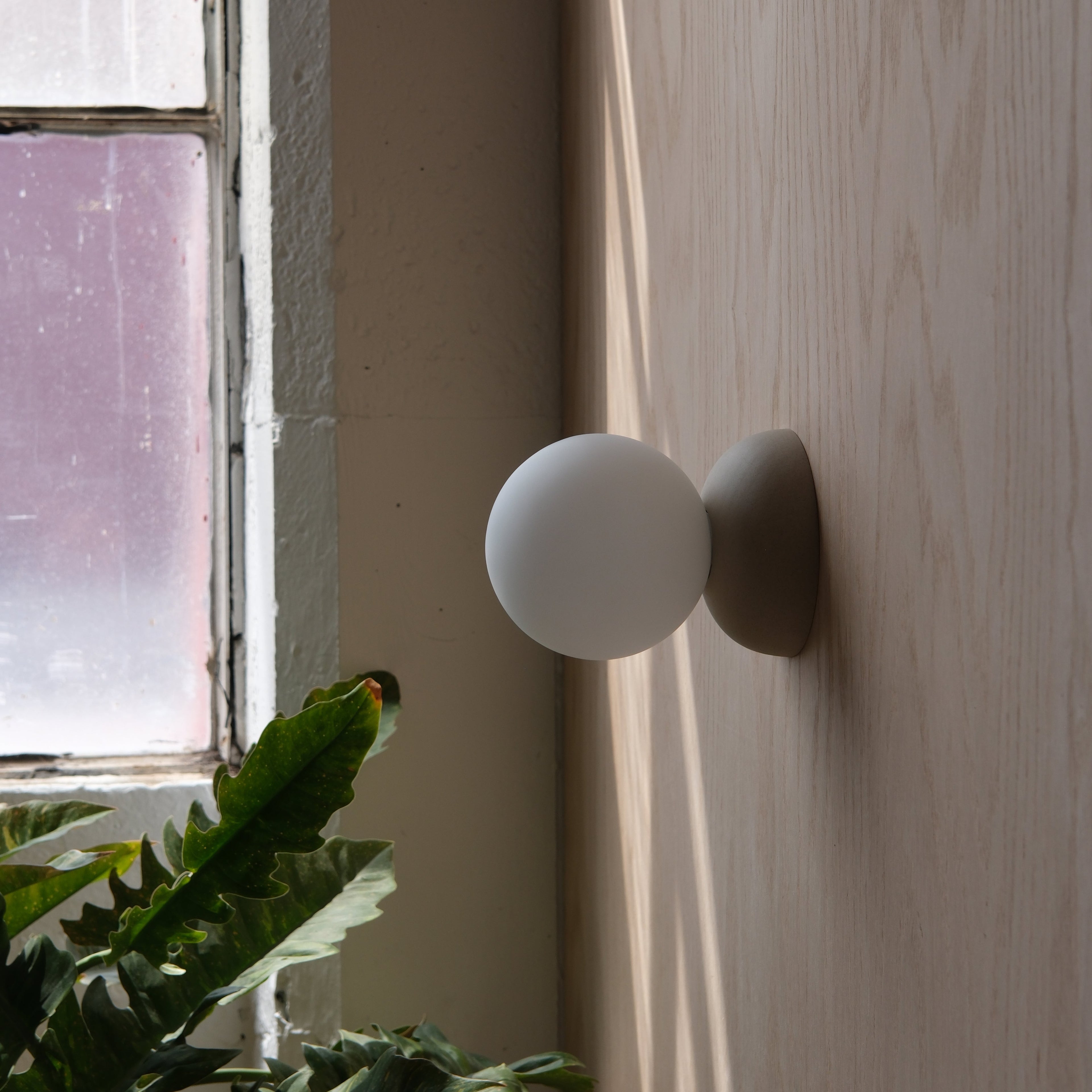 Misewell Monroe Sconce in Black with glass globe