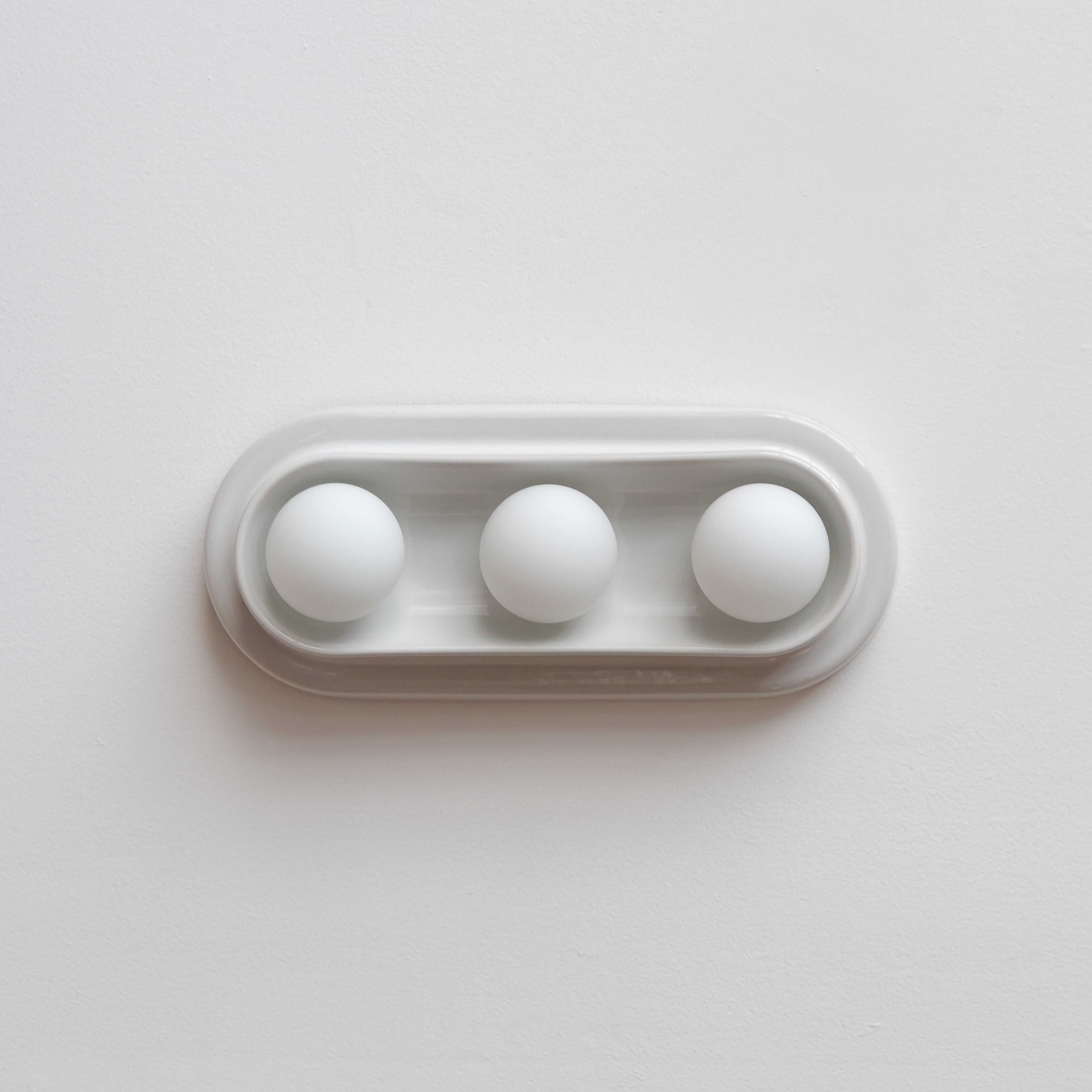 Q Triple Sconce scale against a 7-foot wall