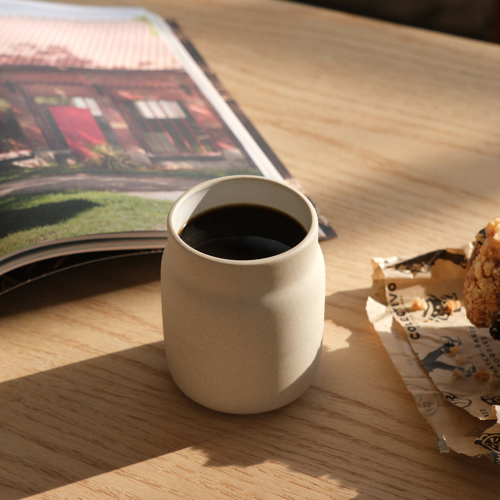 handmade stoneware coffee mug on a kitchen counter