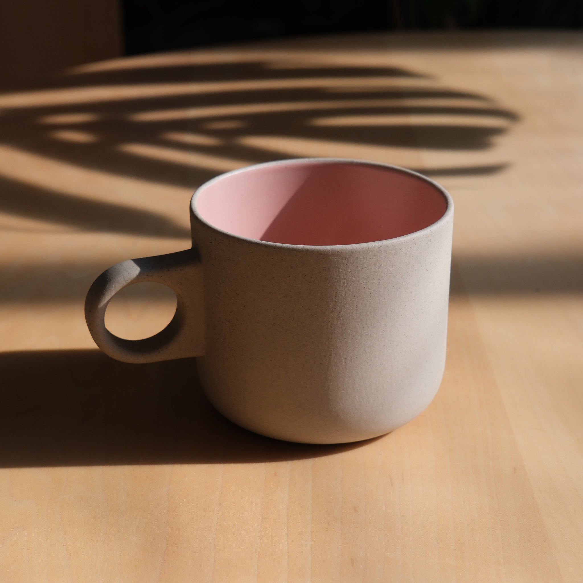 handmade stoneware mug on a kitchen counter