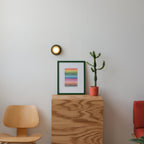 Q Sconce in Yellow glaze, bright accent against pale wall