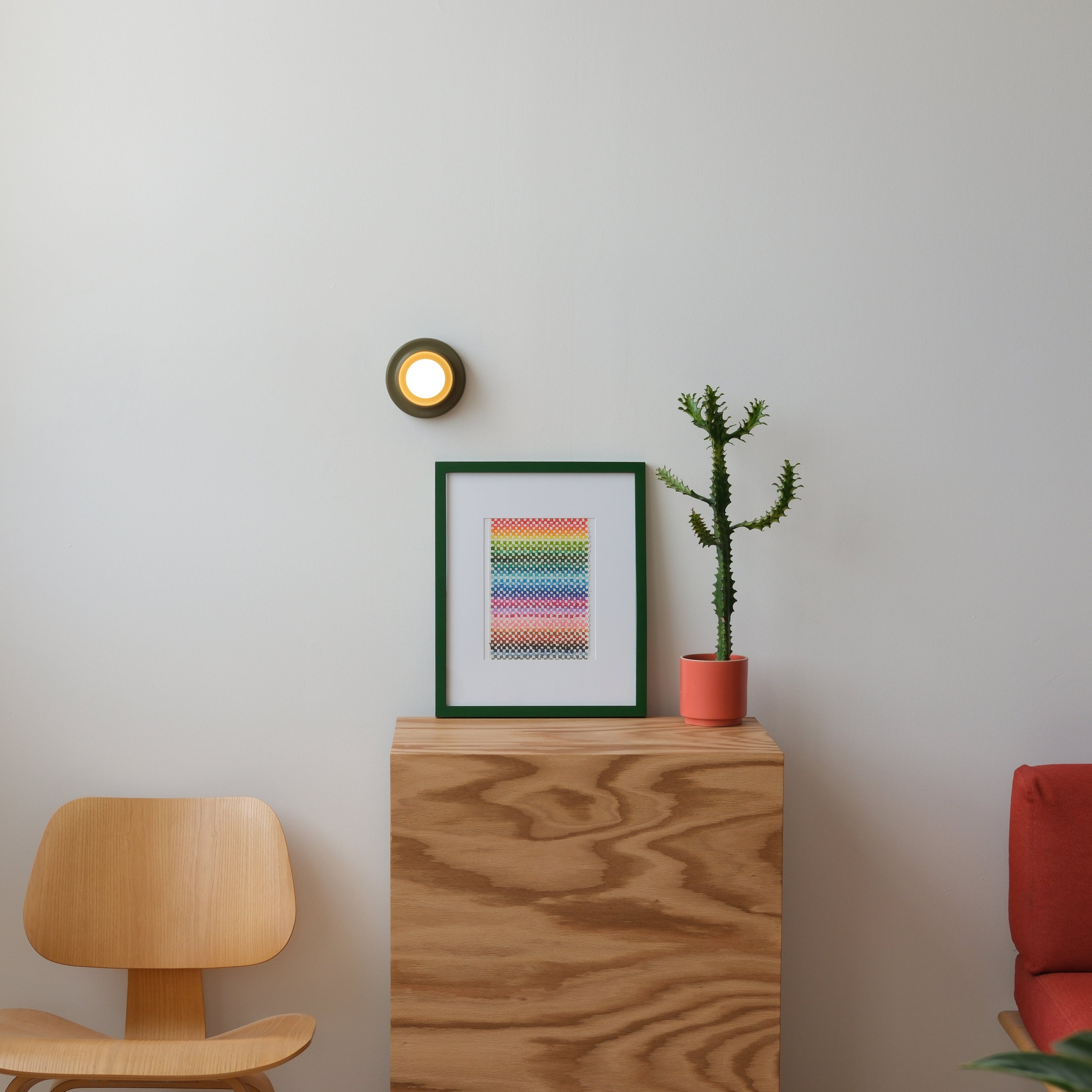 Q Sconce in Yellow glaze, bright accent against pale wall