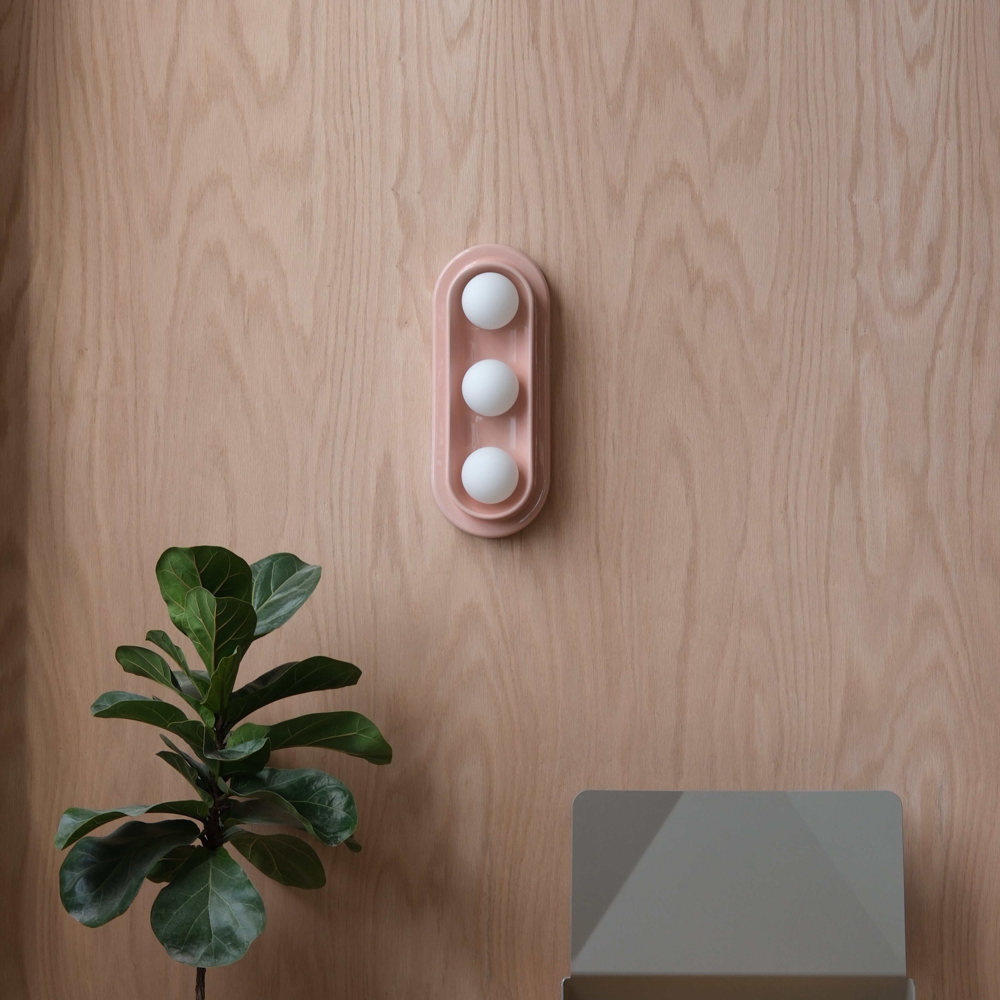 Q Triple Sconce in Dune mounted in a stairwell