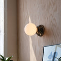 Ripple II Sconce close-up showing rippled chrome body
