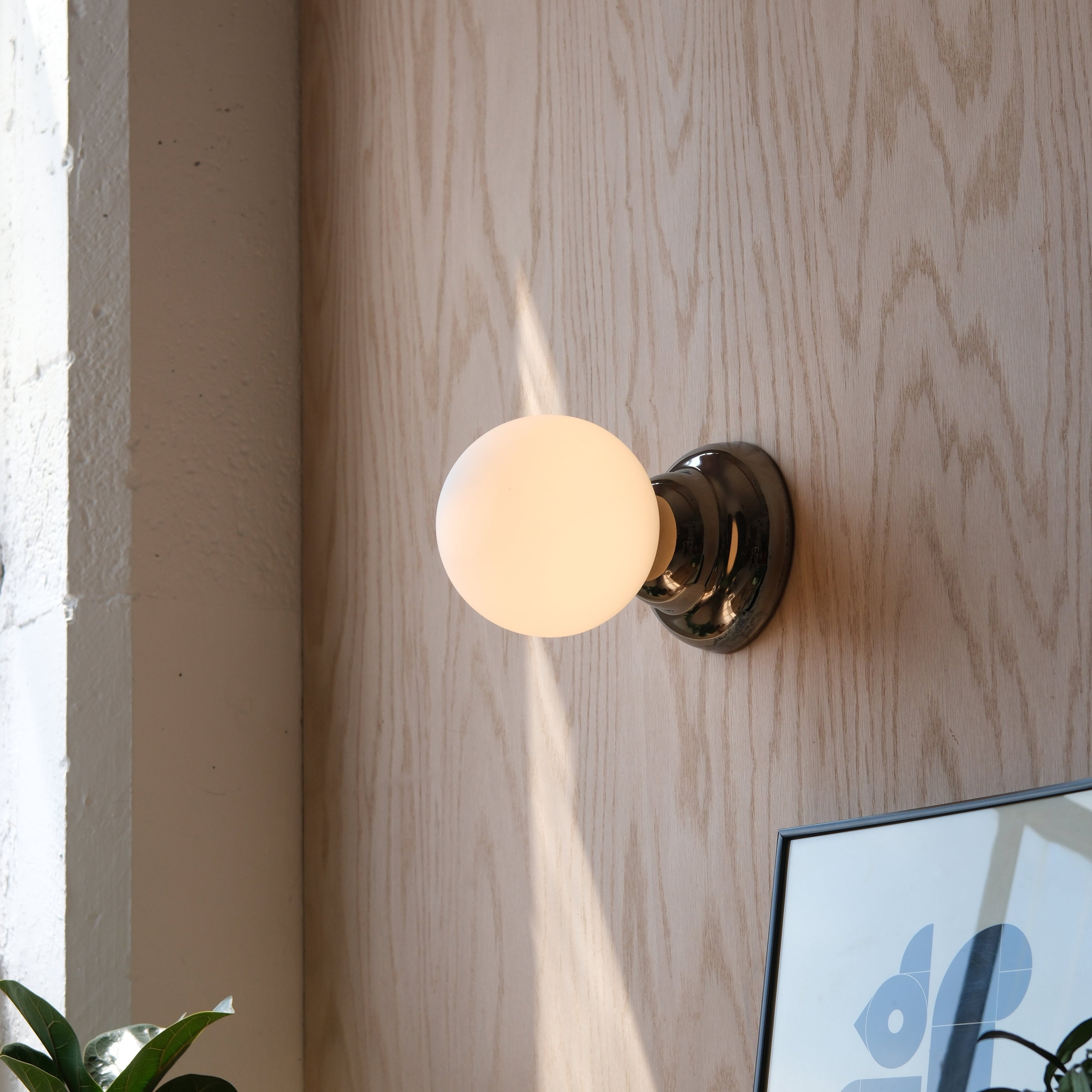 Ripple II Sconce close-up showing rippled chrome body