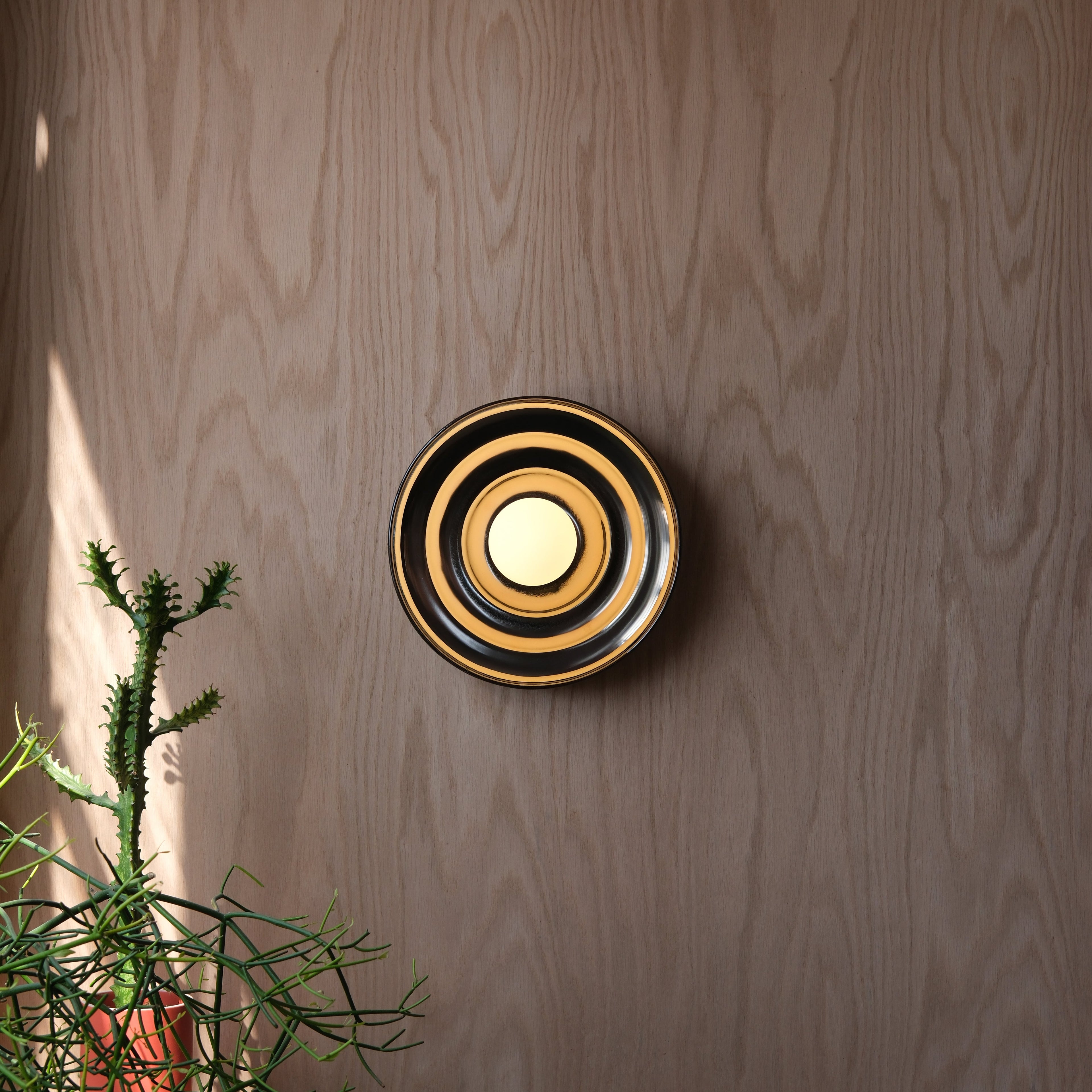Ripple Bowl Sconce lit, back-wash light effect