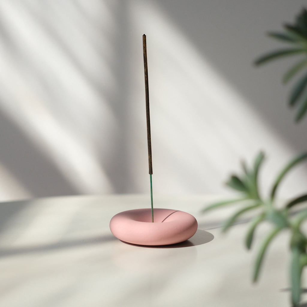 handmade stoneware incense holder on a shelf