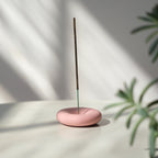 handmade stoneware incense holder on a shelf