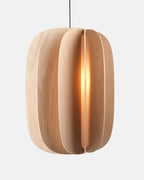 tall white oak pendant light in a double-height room