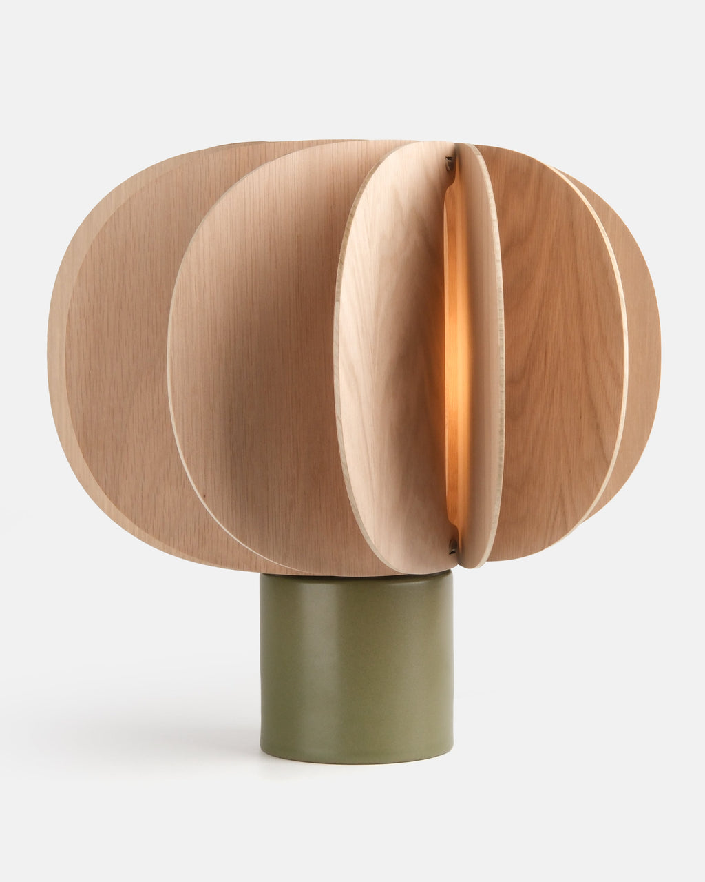 ceramic and wood table lamp in Moss glaze on a console