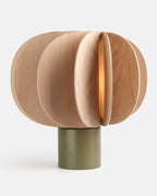 ceramic and wood table lamp in Moss glaze on a console