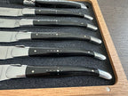 Close view of six horn handles and polished bolsters in the foam tray