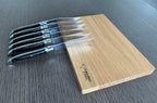 Knives fanned out against the box from another angle
