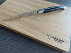 Steak knife resting on the corner of the Laguiole en Aubrac box