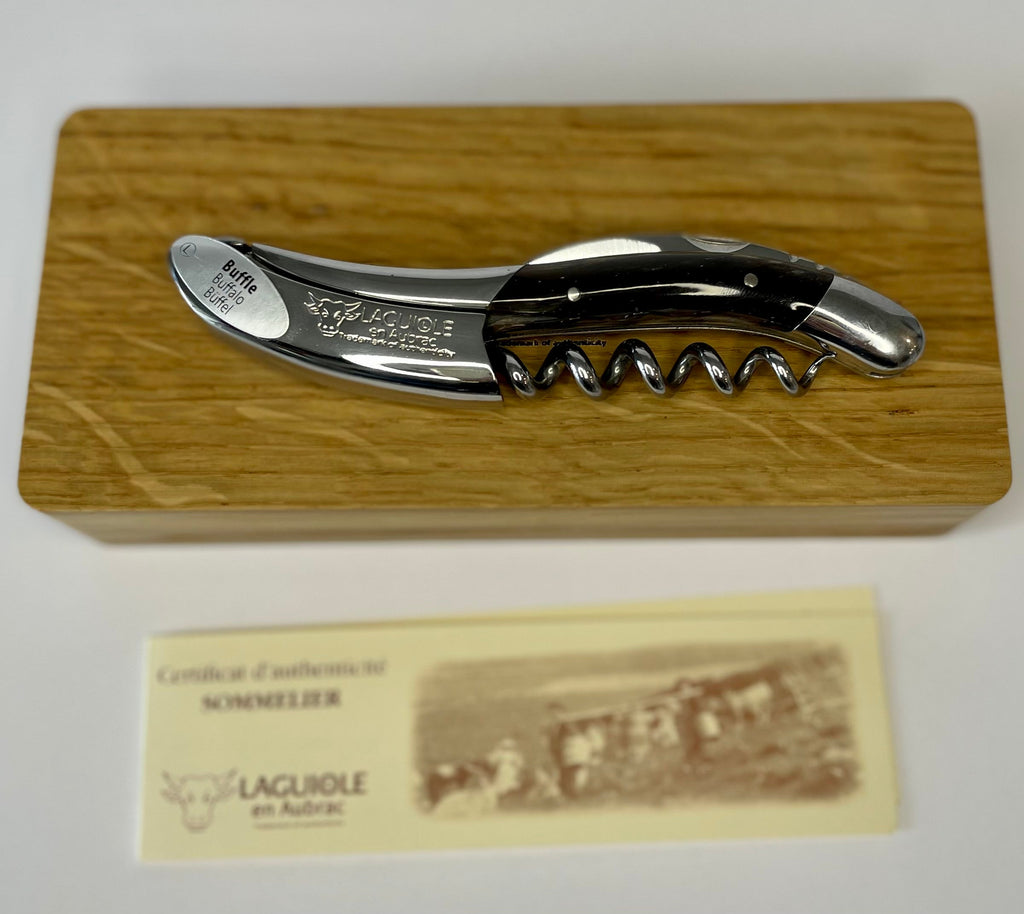 Corkscrew on the oak gift box with the certificate card below